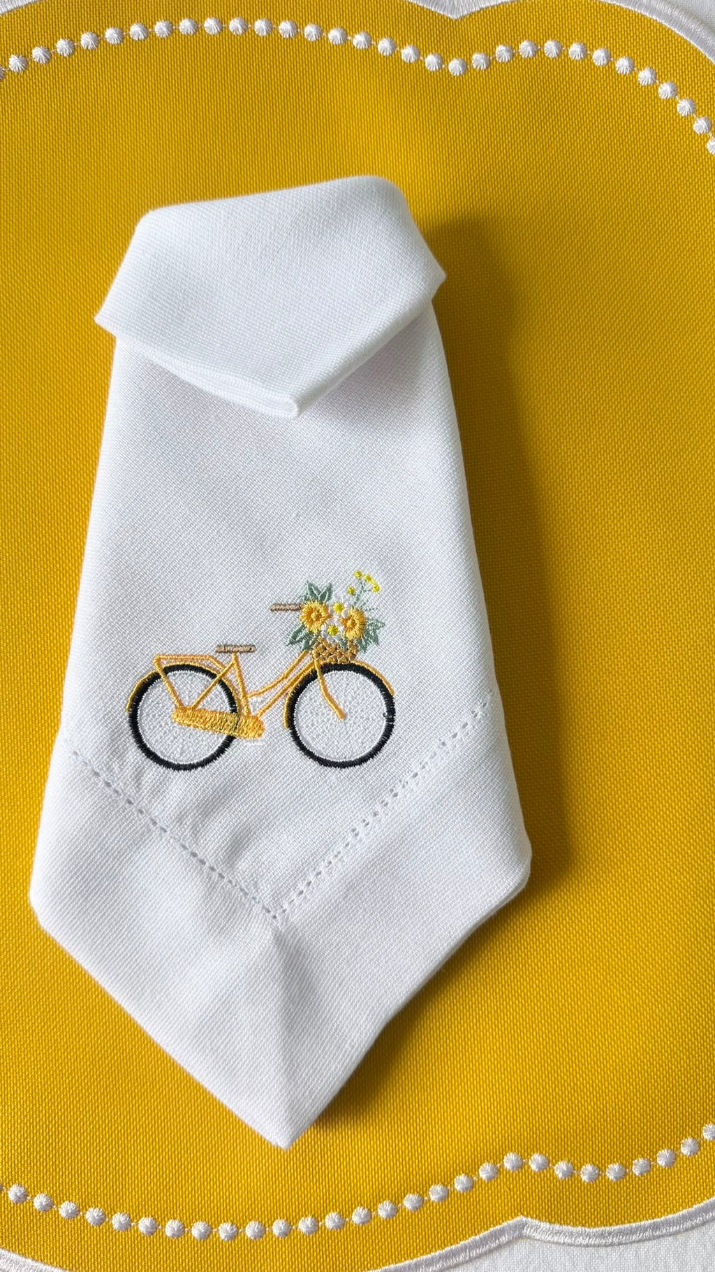 Elegant dining table styled with the handmade yellow bicycle collection.
