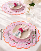 Luxury handmade pink floral embroidered placemat with matching napkin and handmade napkin ring styled on an elegant dining table.